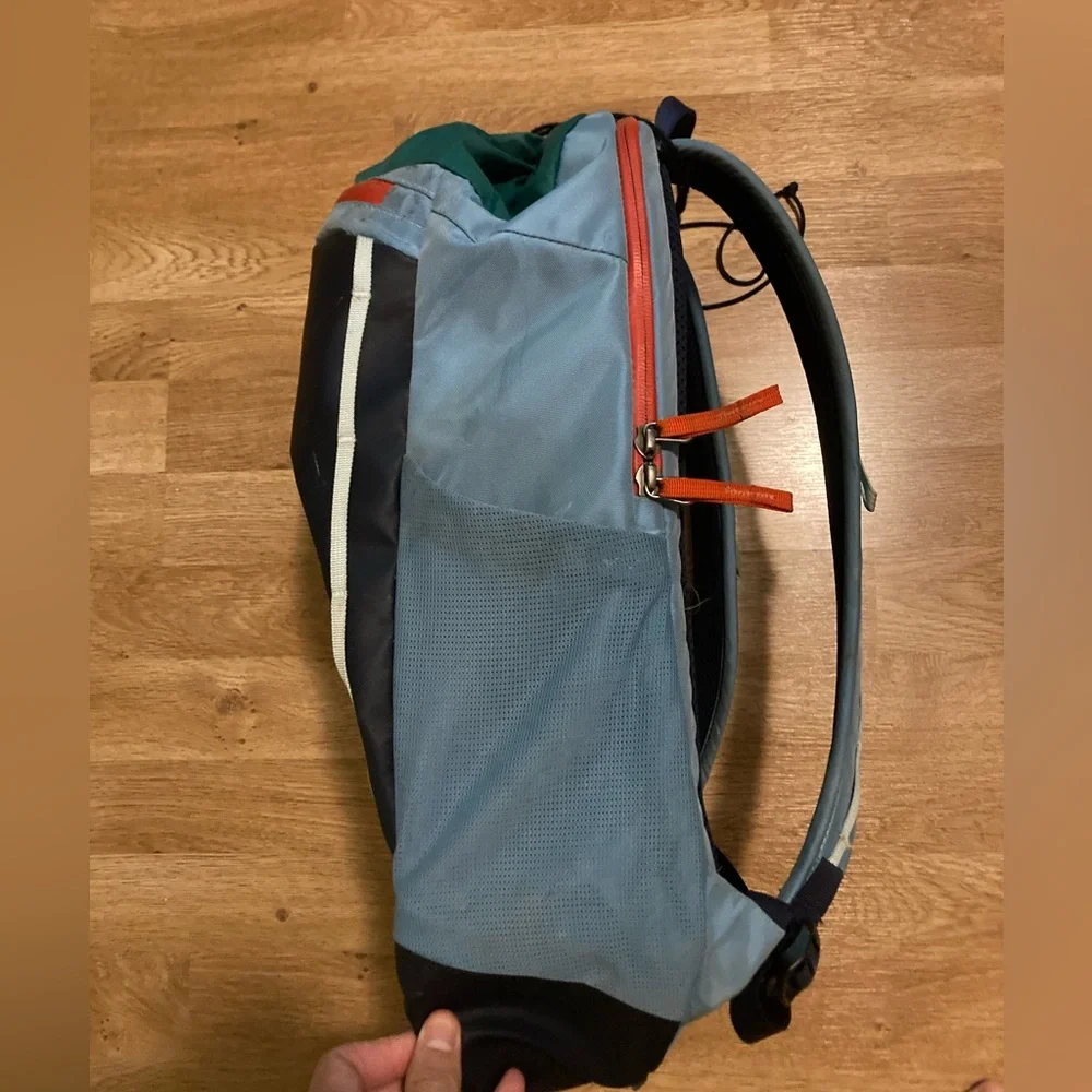 cotopaxi navy blue light blue green striped backpack